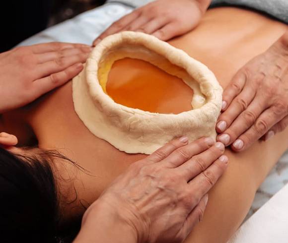 Ayurvedic dough ring for treating pain on the back.
