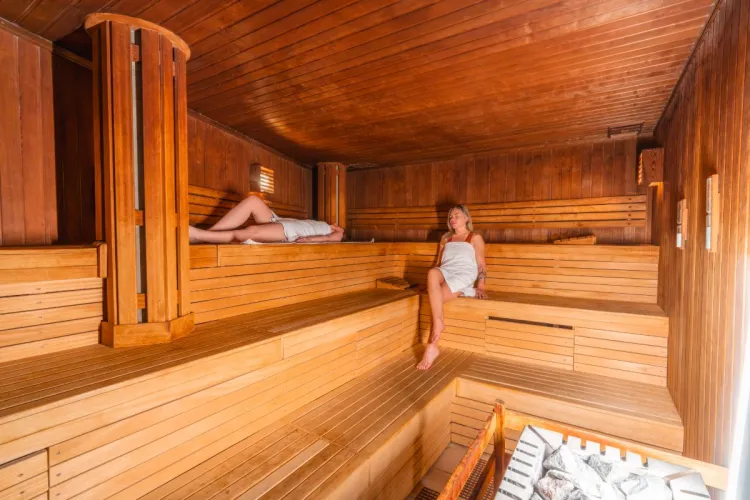 Two woman enjoying the warmth in the sauna area at the Grand Hotel Binz on Rügen.